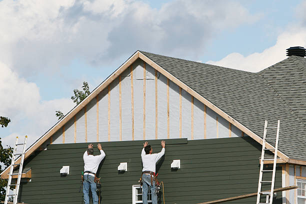 Professional Storm Damage Siding Repair technician working in Woodbury, PA
